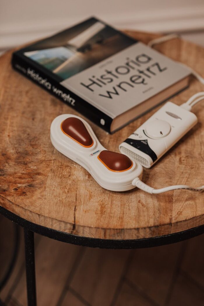 NM 200 handheld massager on a table